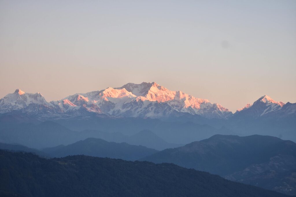 Breathtaking sunrise over the majestic snow-covered Himalayan peaks, offering serene natural beauty.
